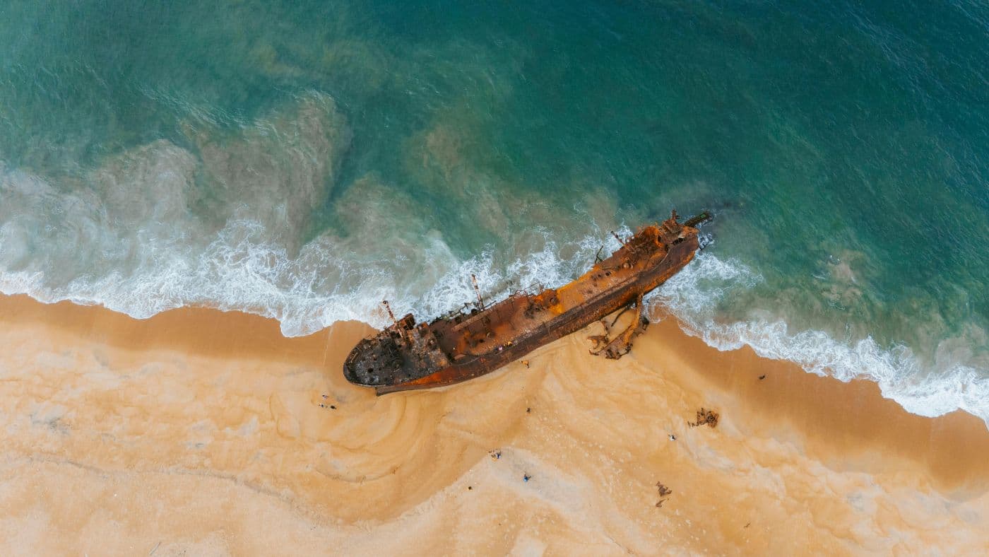 Aerial View of Rusted Shipwreck on Liberian Coast